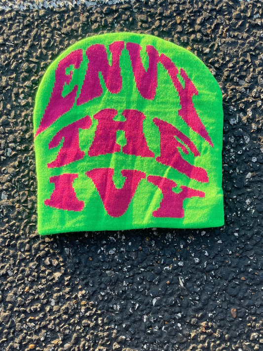 Green and pink patch with 'Envy the Ivy' text on a textured black surface